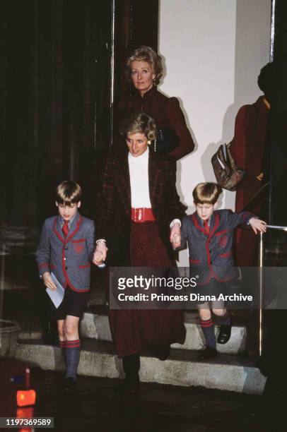 Diana, Princess of Wales with her sons Prince William and Prince Harry at St Matthew's Church in London, after the Wetherby School Christmas carol...