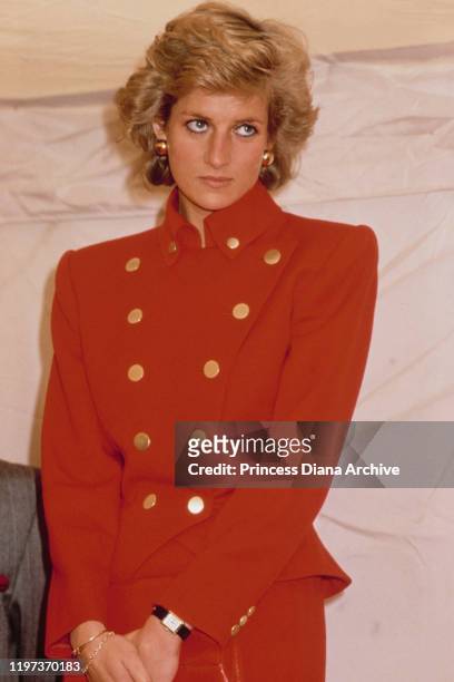 Diana, Princess of Wales wearing a red suit by Catherine Walker during a visit to Pudsey in West Yorkshire, UK, July 1989.