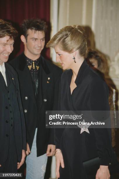Diana, Princess of Wales attends a royal gala in aid of the Prince's Trust charity at the London Palladium, UK, 19th April 1989. Pictured with her is...