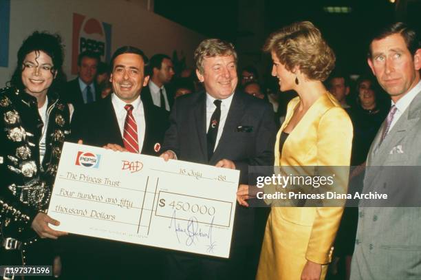 Prince Charles and Diana, Princess of Wales meet singer Michael Jackson backstage at Wembley Stadium in London, before a concert by Jackson in aid of...