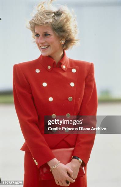 Diana, Princess of Wales during a visit to RAF Wittering in Cambridgeshire, 25th October 1989. She is wearing a red suit by Catherine Walker. Diana...