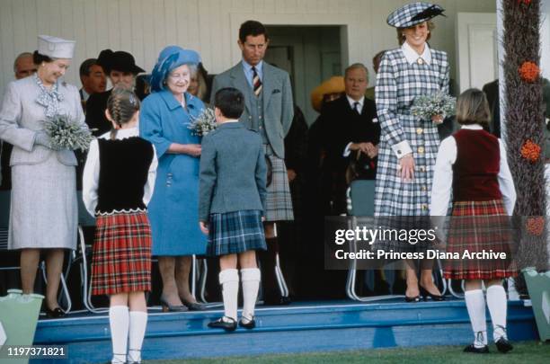 From left to right, Queen Elizabeth II, the Queen Mother, Prince Charles and Diana, Princess of Wales at the Braemar Games, a Highland Games...