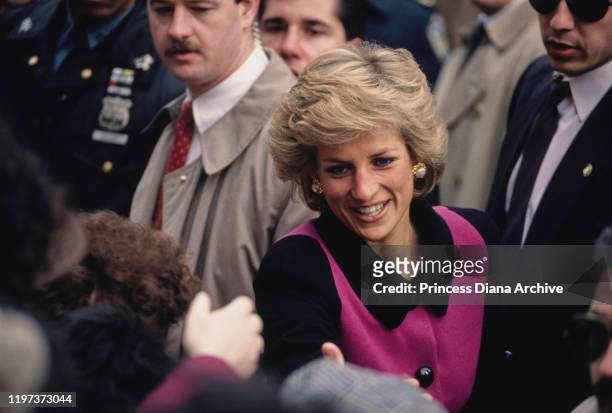 Diana, Princess of Wales visits the Henry Street Settlement on the Lower East Side in New York City, February 1989. She is wearing a pink and black...