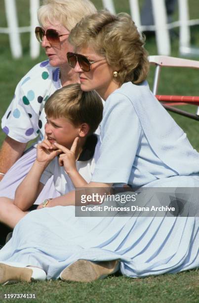 Diana, Princess of Wales with her mother Frances Shand Kydd and her son Prince William at a Cartier International Polo match on Smith's Lawn in...