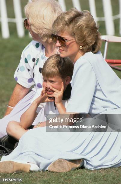 Diana, Princess of Wales with her mother Frances Shand Kydd and her son Prince William at a Cartier International Polo match on Smith's Lawn in...