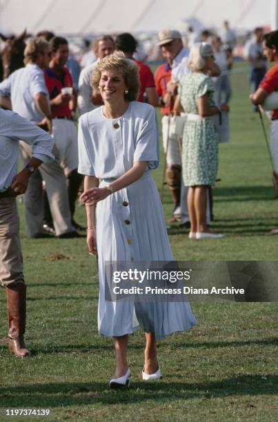 Diana, Princess of Wales at a Cartier International Polo match on Smith's Lawn in Windsor, UK, July 1989. She is wearing a dress by Catherine Walker.