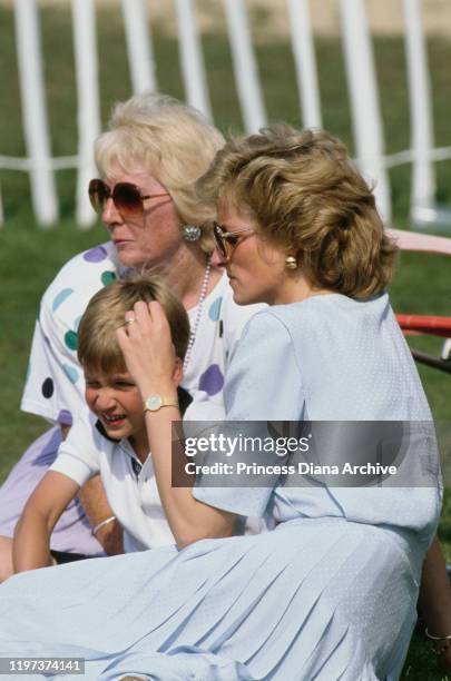 Diana, Princess of Wales with her mother Frances Shand Kydd and her son Prince William at a Cartier International Polo match on Smith's Lawn in...