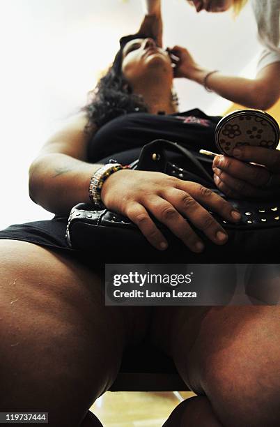 Participant of 22nd edition of the Italian 'Miss Cicciona' is seen during the make-up backstage on July 23, 2011 in Pisa, Italy.