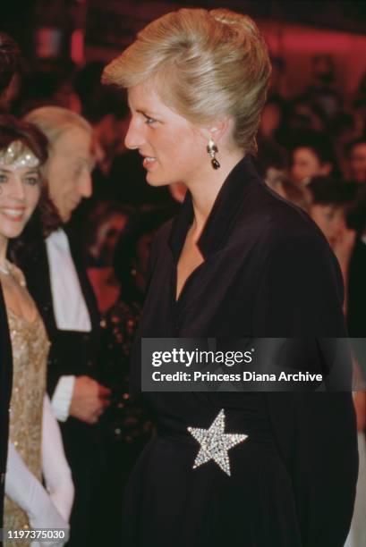 Diana, Princess of Wales wearing a black cocktail dress with a star ornament to the Laurence Olivier Awards at the Dominion Theatre in London, 29th...