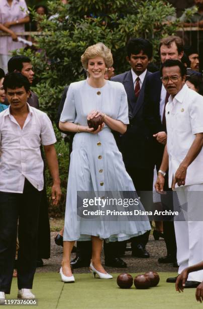 Diana, Princess of Wales tries bowling at the Sitanala Leprosy Hospital in Tangerang, Greater Jakarta, Indonesia, November 1989. She is wearing a...