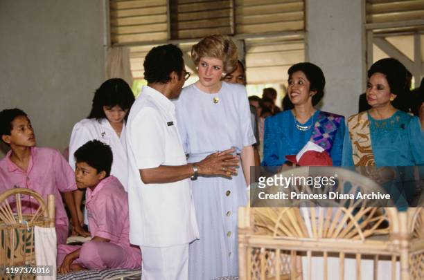 Diana, Princess of Wales visits the Sitanala Leprosy Hospital in Tangerang, Greater Jakarta, Indonesia, November 1989. She is wearing a dress by...