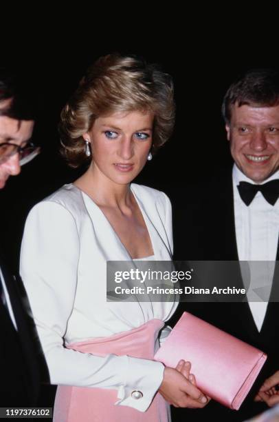 Diana, Princess of Wales attends a performance of 'Swan Lake' by the Bolshoi Ballet at the London Coliseum, 27th July 1989. She is wearing a pink and...