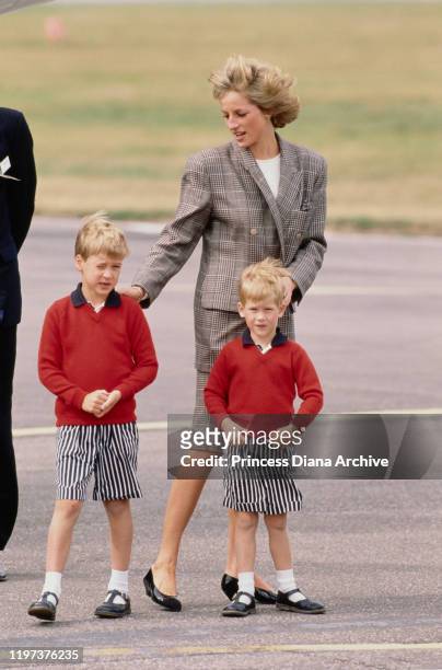 Diana, Princess of Wales arrives at Aberdeen airport in Scotland on the Royal Flight, with her sons Prince William and Prince Harry, 14th August...