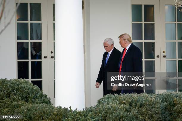 Vice President Mike Pence and U.S. President Donald Trump walk to the Oval Office following a signing ceremony for the United States-Mexico-Canada...