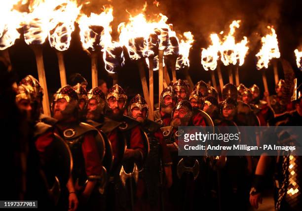The Guizar Jarl squad march ahead of the burning of the galley during Up Helly Aa 2020 in Lerwick.