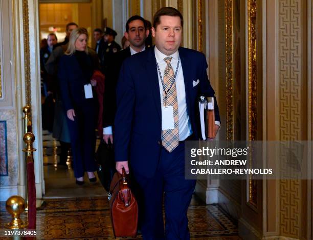 Members of US President Donald Trumps legal team arrive before the start of the impeachment trial against US President Donald Trump on January 29,...