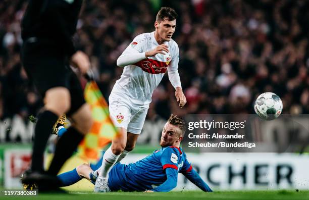 Pascal Stenzel of Stuttgart in action against Tobias Mohr of Heidenheim during the Second Bundesliga match between VfB Stuttgart and 1. FC Heidenheim...