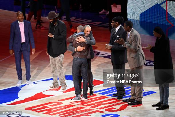 Legends Dell Curry and Tony Parker hug before the game between the Charlotte Hornets and the Milwaukee Bucks as part of NBA Paris Games 2020 on...