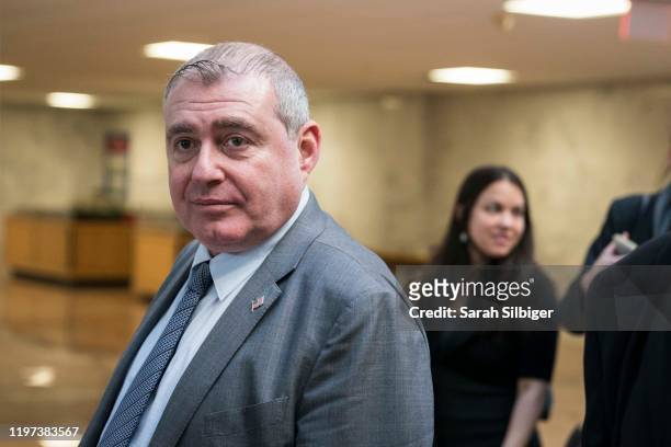 Lev Parnas, an associate of President Donald Trump's personal lawyer Rudy Giuliani, walks through the Hart Senate Office Building after attempting to...