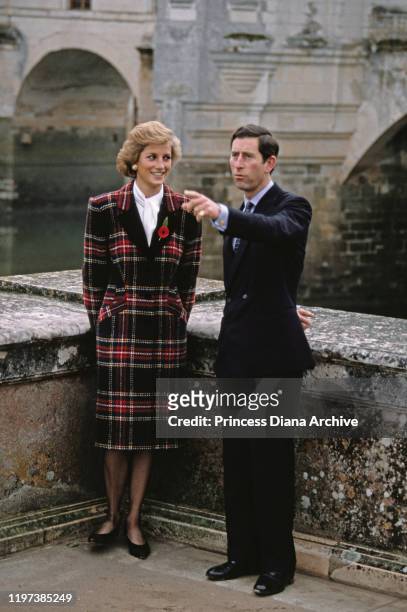 Prince Charles and Diana, Princess of Wales visit the Château de Chenonceau on the River Cher in France, November 1988. Diana is wearing a tartan...