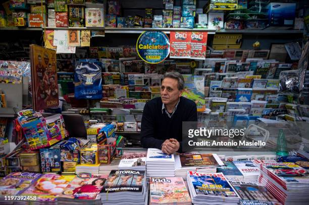 Franco Farinelli, a newsagent, poses for a photograph in his newsstand open during the "notte bianca" of newsstands, on January 29 in Rome, Italy....