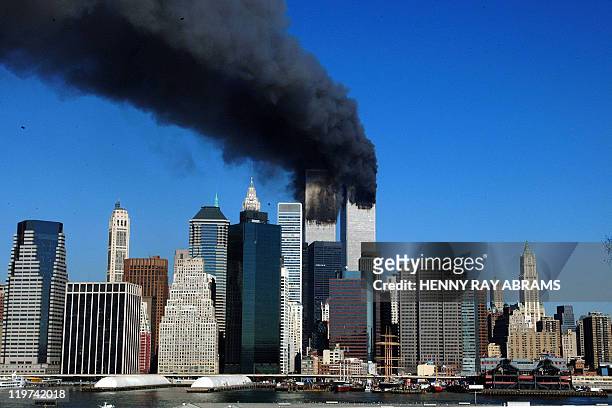 The twin towers of the World Trade Center billow smoke after hijacked airliners crashed into them early 11 September, 2001. The suspected terrorist...