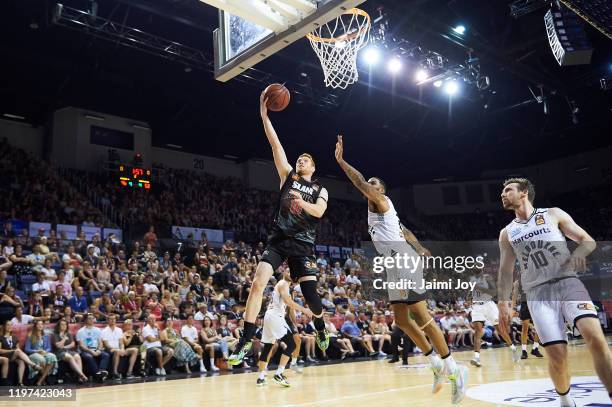 Angus Glover of Illawarra Hawks shoots as he is defended by Shawn Long of Melbourne United during the round 14 NBL match between the Illawarra Hawks...