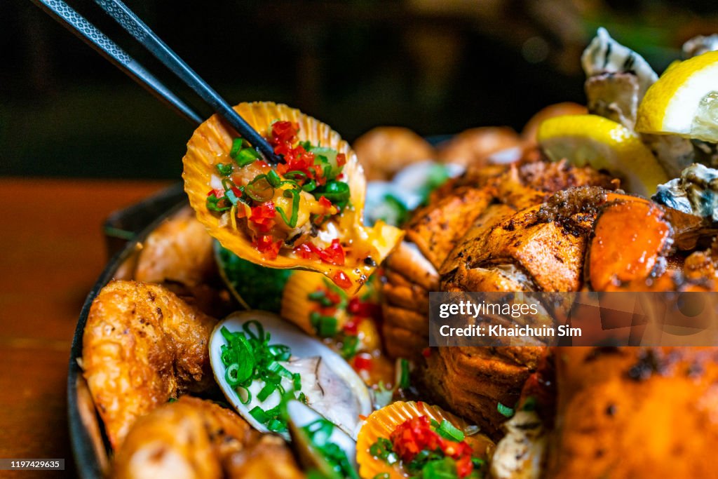 Seafood barbecue platter, focus on scallop