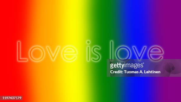 "love is love" text on rainbow colored background - pride gradient stock pictures, royalty-free photos & images