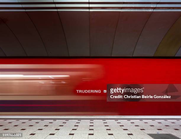 u-bahn station trudering with blurred movement of traveling subway, munich, germany - subway station stock pictures, royalty-free photos & images