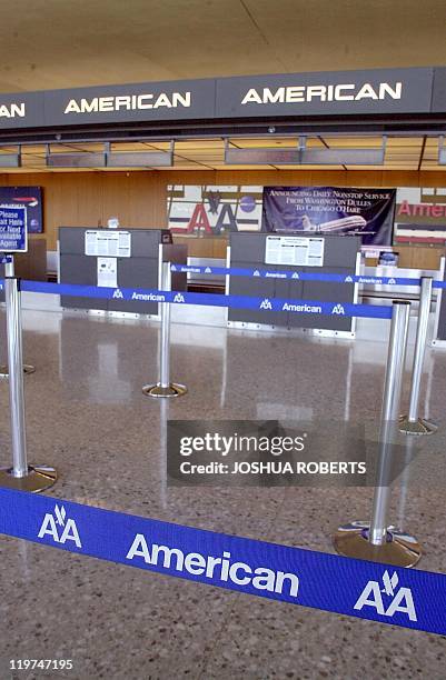This 11 September, 20011 image shows the deserted American Airlines ticket counter at Dulles International Airport in Chantilly, Virginia. In...