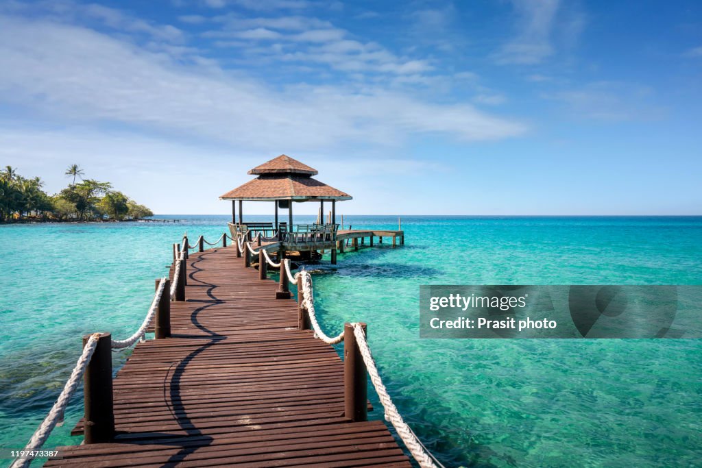 Wooden bar in sea and hut with nice blue sky in Koh Kood at Trat, Thailand. Asia Summer, Travel, Vacation and Holiday concept.