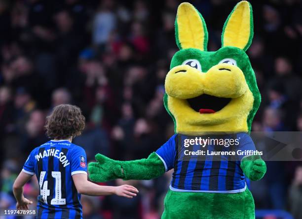 Luke Matheson of Rochdale celebrates with the Rochdale mascot, Desmond the Dragon after the FA Cup Third Round match between Rochdale AFC and...