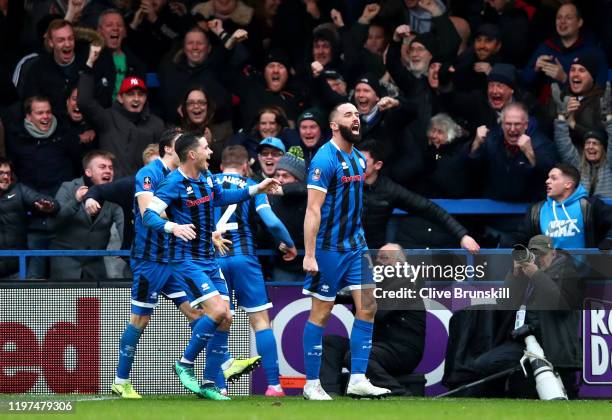 Aaron Wilbraham of Rochdale celebrates with teammates after scoring his team's first goal during the FA Cup Third Round match between Rochdale AFC...