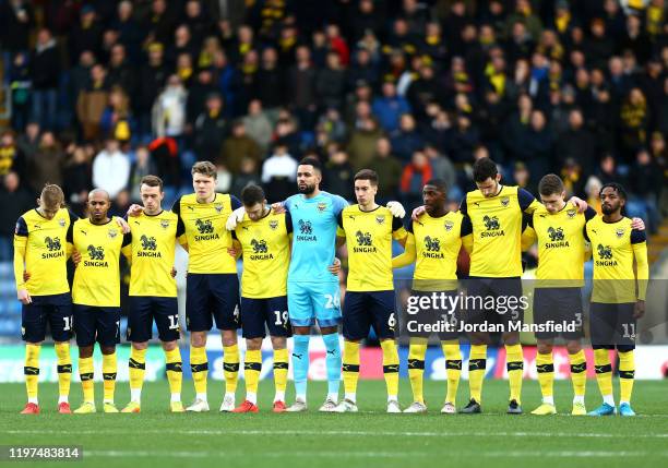 Oxford United players observe a minute of silence in support of the Heads Up campaign and to remember those with a connection to Oxford United FC...