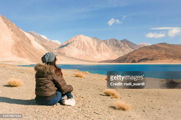 young asian traveling in pingong lake, ladakh india - jammu and kashmir stock pictures, royalty-free photos & images