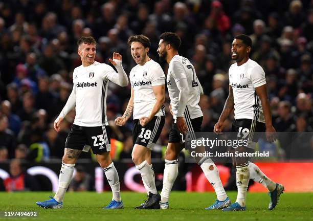 Harry Arter of Fulham celebrates with teammates after scoring his team's second goal during the FA Cup Third Round match between Fulham FC and Aston...