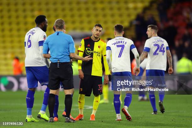 Roberto Pereyra of Watford reacts to Kieron Morris of Tranmere Rovers after receiving a red card during the FA Cup Third Round match between Watford...