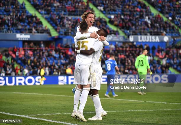 Luka Modric of Real Madrid celebrates with teammates after scoring his team's third goal during the La Liga match between Getafe CF and Real Madrid...