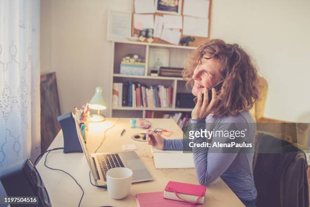 Curly Woman working from Home Office