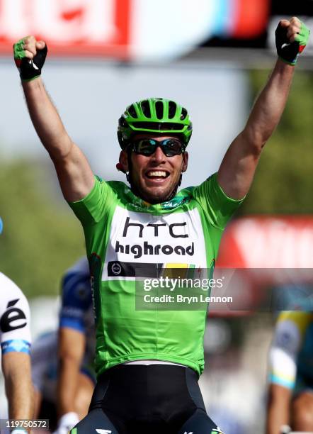 Mark Cavendish of team HTC wins the final sprint and the green points jersey during the twenty first and final stage of Le Tour de France 2011, from...