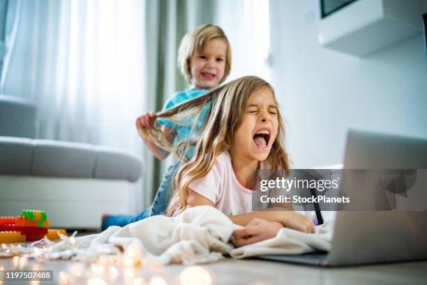 brother and sister fight - siblings fighting stock pictures, royalty-free photos & images
