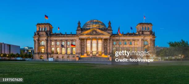 berlin reichstag german parliament illuminated at dusk panorama germany - national council stock pictures, royalty-free photos & images