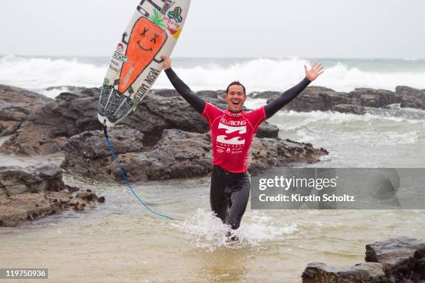 Jordy Smith of South Africa claims his victory at the Billabong Pro Jeffreys Bayon July 24, 2011 in Jeffreys Bay, South Africa.