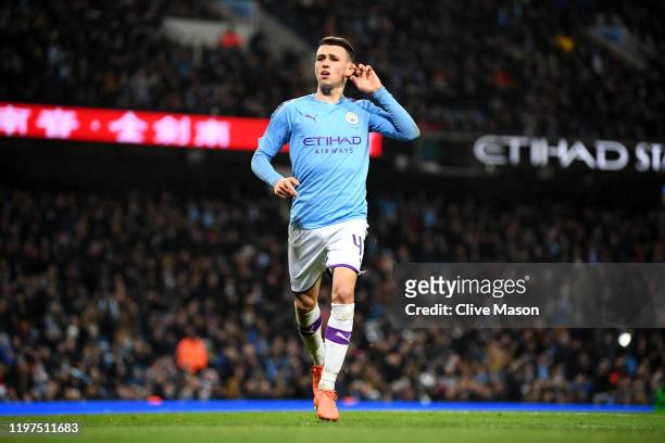 Phil Foden of Manchester City celebrates after scoring his team's fourth goal during the FA Cup Third Round match between Manchester City and Port...