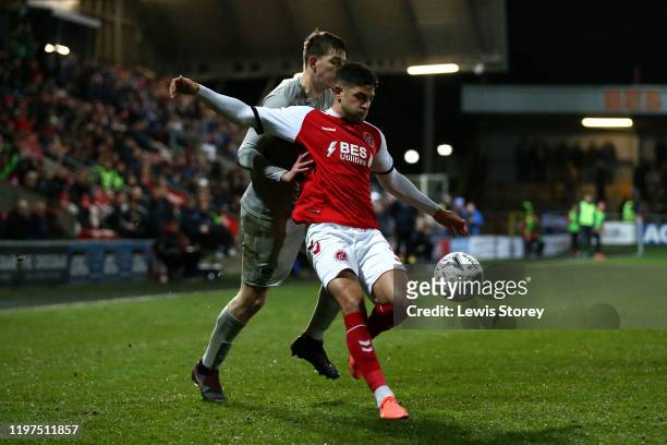 Danny Andrew of Fleetwood Town battles for possession with Steve Seddon of Portsmouth FC during the FA Cup Third Round match between Fleetwood Town...