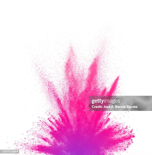explosion by an impact of a cloud of particles of powder of pink color  on a white background. - colour powder explosion stockfoto's en -beelden