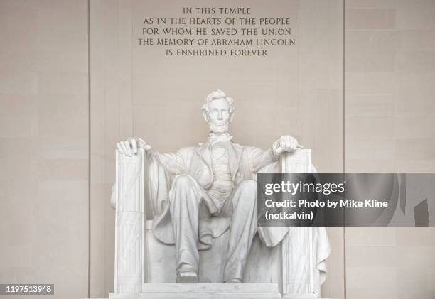 direct front view of abraham lincoln statue at lincoln memorial. - lincoln memorial stock pictures, royalty-free photos & images