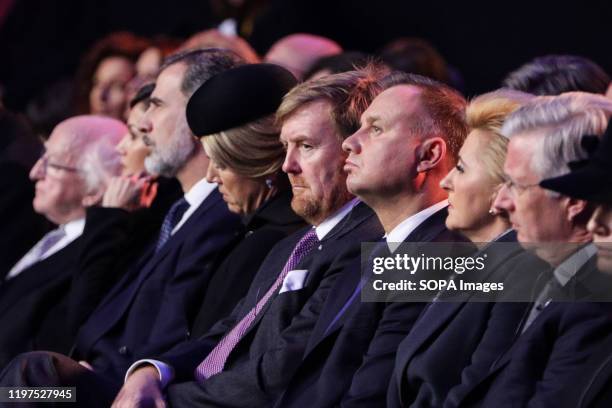 President of Poland Andrzej Duda sits between King Willem-Alexander of Netherlands and Poland's First Lady Agata Kornhauser-Duda during the ceremony....