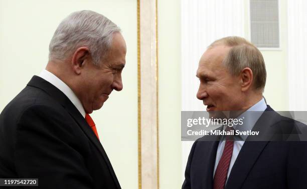 Russian President Vladimir Putin greets Israeli Prime Minister Benjamin Netanyahu dduring their meeting at the Kremlin on January 30, 2020 in Moscow,...